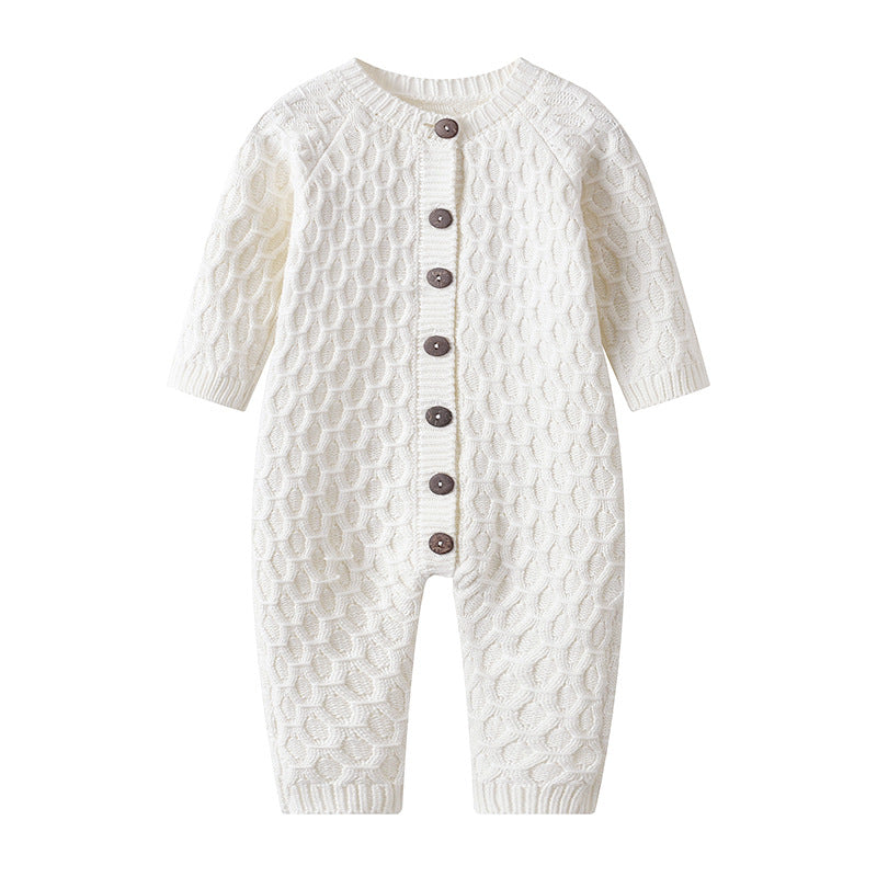 White knit jumpsuit with a brown button front and rhombus knit design, perfect for a cozy and stylish look