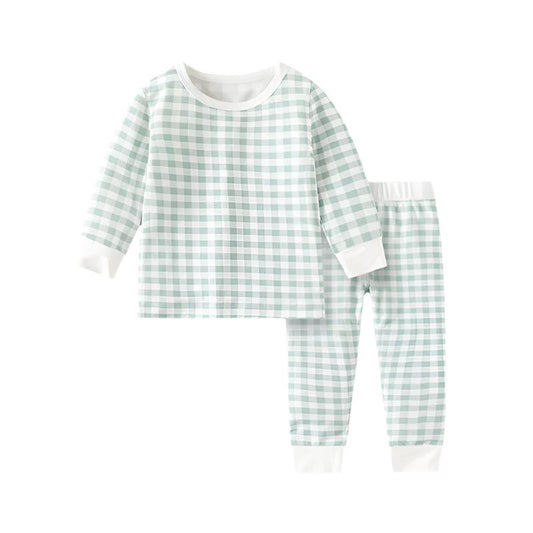 Adorable baby and toddler clothing by Isla + Bo featuring comfortable, breathable, and machine washable outfits. Includes bamboo sleepers, cotton knit sets, classic denim dresses, and more in a variety of styles and prints like floral, plaid, and animal designs.